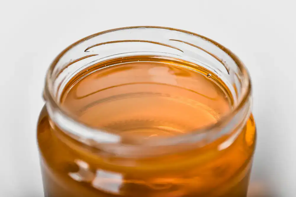 Jar of rich amber Summer Gold Honey