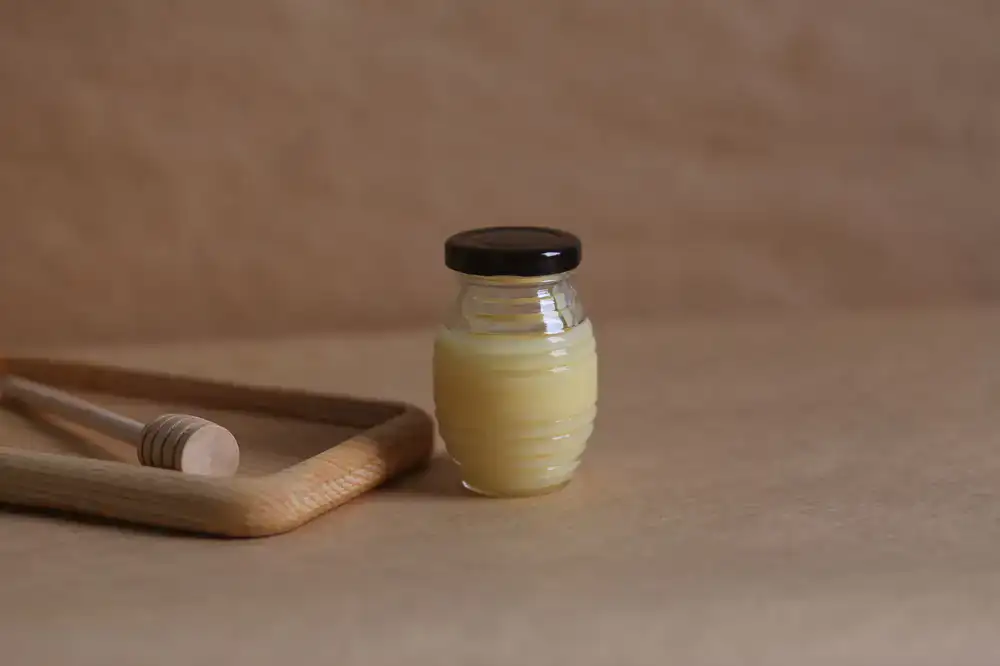 Curated honey gift set with beeswax candle and wooden dipper